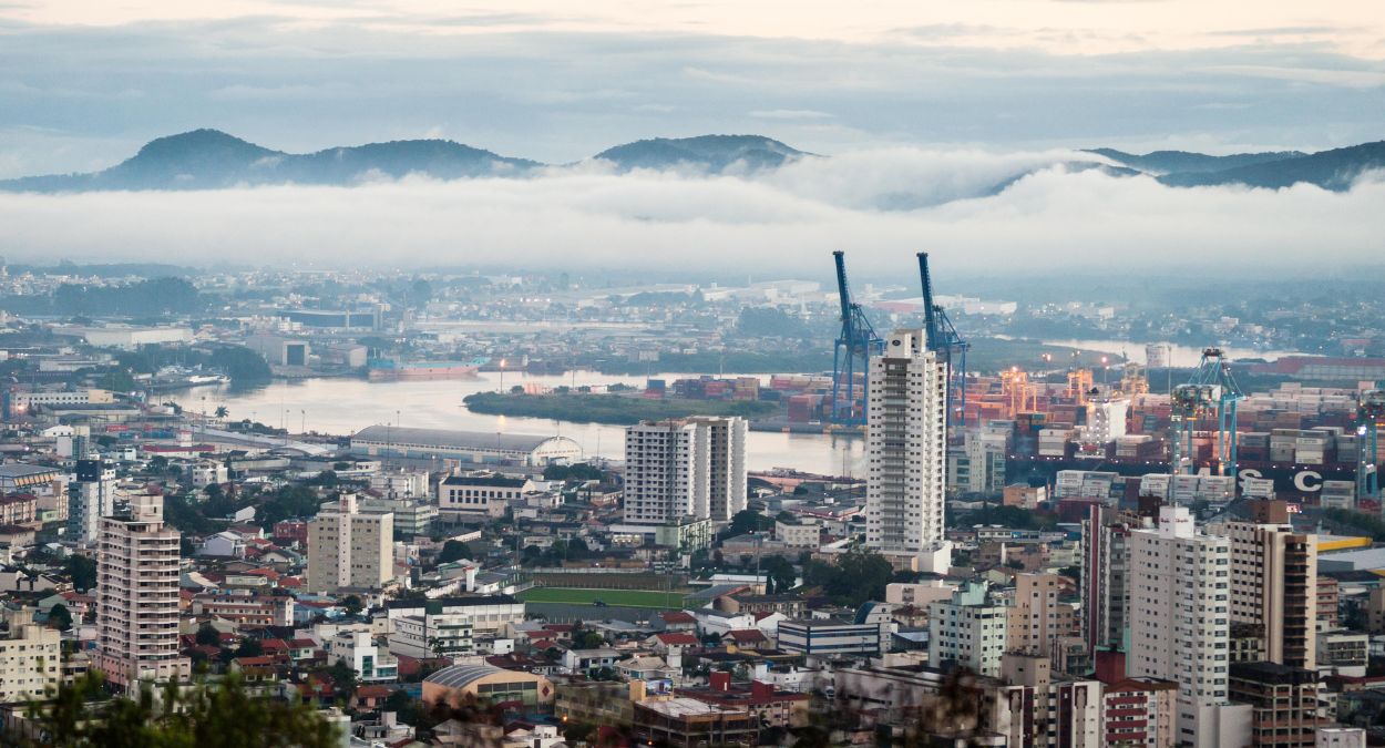 a city with buildings and a body of water